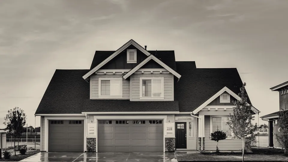 House at dusk with every window lit